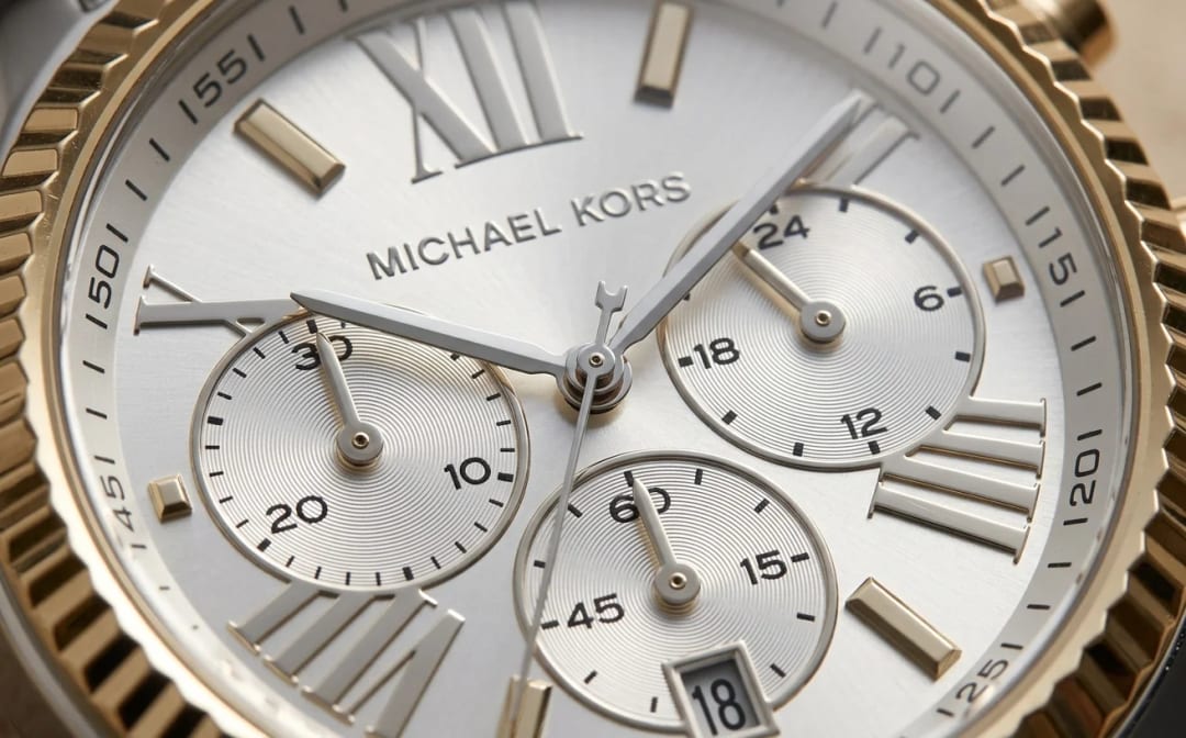 Extreme macro of the Michael Kors MK5955 Lexington dial showing the three chronograph subdials, engraved indices and hands