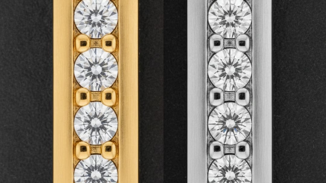 Macro comparison of two settings, one in warm gilt metal, the other in cold grey steel