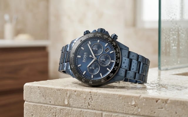 Hugo Boss 1513758 chronograph steel watch with midnight blue dial positioned on the edge of a shower with water droplets