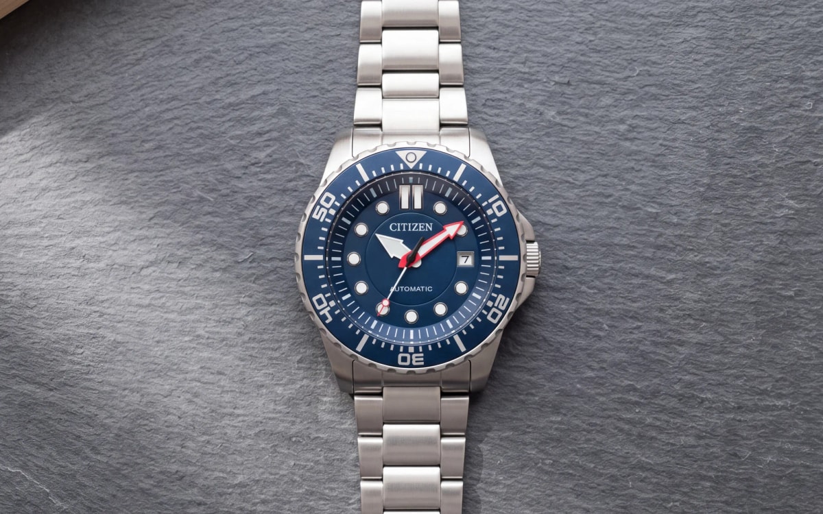 Citizen automatic NJ0121-89L, navy rotating bezel and dial, steel bracelet, on slate