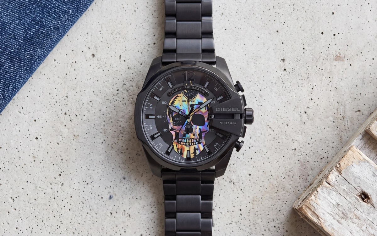 Diesel Mega Chief Skull Rainbow DZ4582 black chronograph with iridescent skull dial on raw concrete