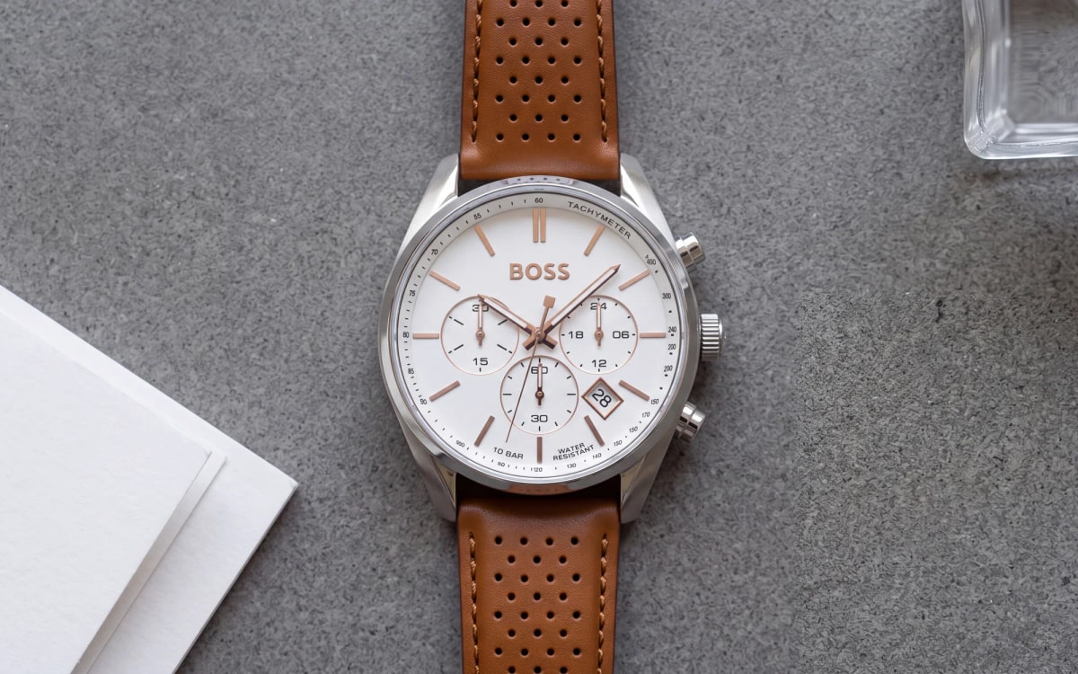 HUGO BOSS Champion 1513879 men's chronograph with white dial and perforated cognac leather strap on concrete