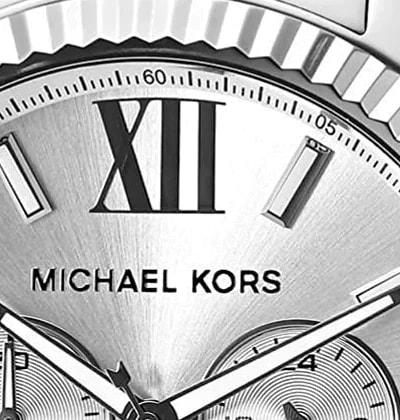 Michael Kors signature printed below the Roman numerals on the dial of a Lexington MK8405